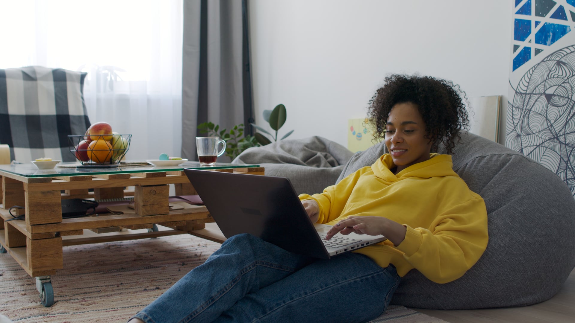 Person using Laptop in Living Room
